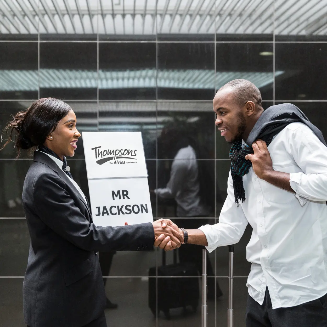 Thompsons Africa representative welcoming a guest with a personalized meet and greet at the airport